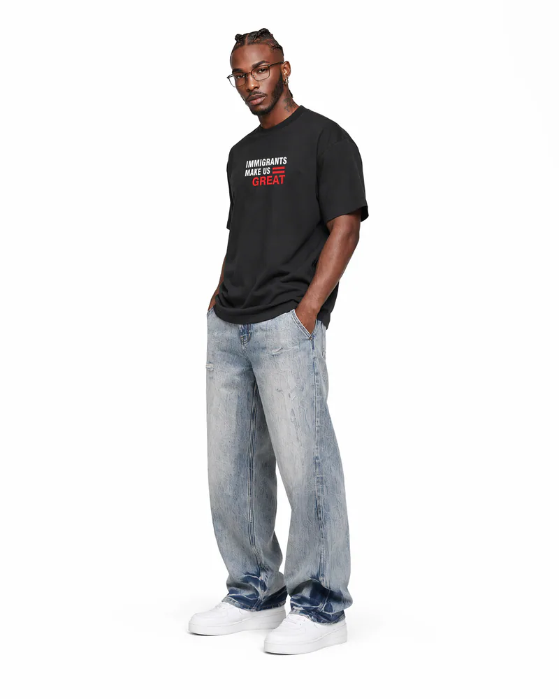The Foundation Tee Decree in Onyx Black, worn, three-quarter view